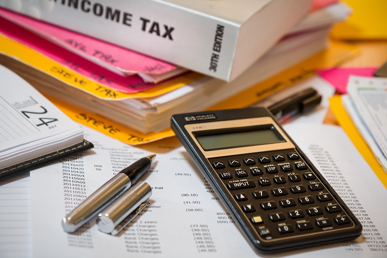 Tax calculator and documents on a desk